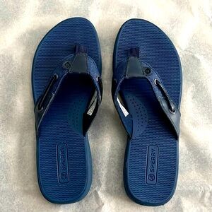 Sperry flip flops in a bright navy blue color.